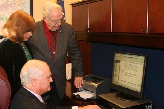 Freeholder John P. Curley views the online Veteran's Guide as Veteran's Service Director Sue Moleon and Michael Ruane, director of the Monmouth County Office on Aging, Disabilities and Veterans Services look on. Freeholder John P. Curley views the online Veteran's Guide as Veteran's Service Director Sue Moleon and Michael Ruane, director of the Monmouth County Office on Aging, Disabilities and Veterans Services look on.